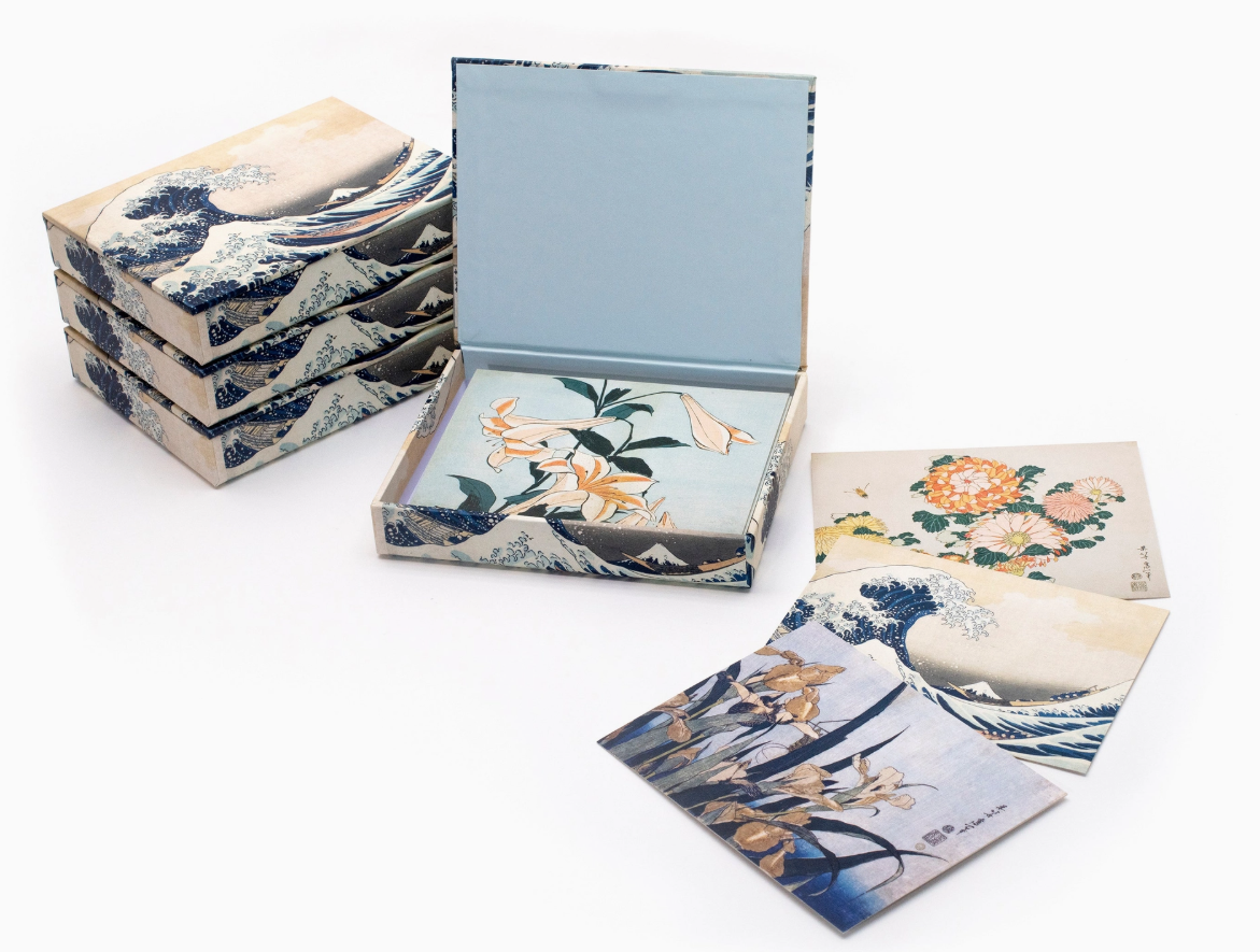 Set of decorative boxes with floral and nature-themed designs on a white background
